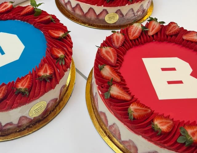 Three coldcakes printed with the Browserbase logo, edible ink on strawberry frosting