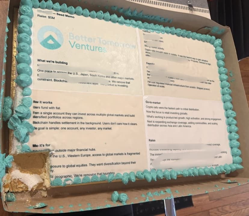 A coldcake delivered to Better Tomorrow Ventures: a Seed Memo iced onto the cake with the BTV logo, teal-piped border, one corner already eaten