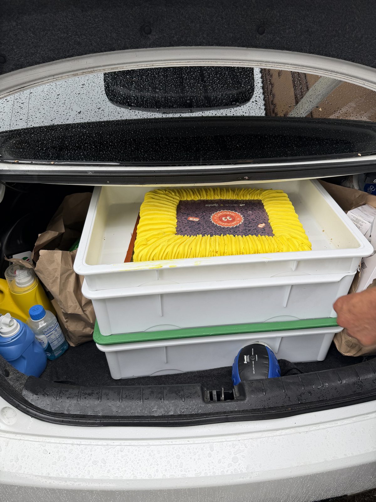 Ten rain-soaked cakes outside the Y Combinator campus on the morning of April 18, 2026.